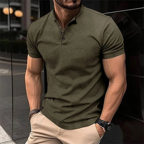Olive green men's fitted polo shirt with short sleeves, displayed on a model. The shirt features a smart casual design, suitable for various occasions. The model is wearing a light green variant in size 2XL.