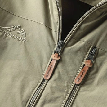 Olive green men's lightweight hooded windbreaker jacket with long sleeves and a water-resistant textile, featuring a front zip closure and a casual design.