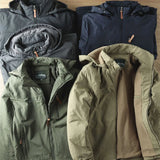 Olive green men's lightweight hooded windbreaker jacket featuring long sleeves and made from water-resistant material.