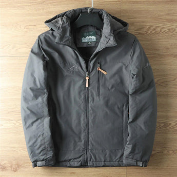 Men's lightweight hooded windbreaker jacket in olive green with gray accents, featuring long sleeves, a collar, front pockets, and button details, made from water-resistant material.