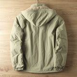 Olive green men's lightweight hooded windbreaker jacket hanging on a clothes hanger, showcasing its water-resistant material, long sleeves, and subtle design details.