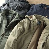 Olive green men's lightweight hooded windbreaker jacket featuring a water-resistant fabric, long sleeves, and a comfortable fit.