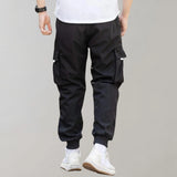 Olive green men's tapered cargo pants featuring a lightweight design ideal for utility fashion, highlighting details such as a comfortable waistline and tapered thighs, perfect for active or casual wear.