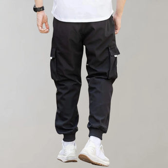 Olive green men's tapered cargo pants featuring a lightweight design ideal for utility fashion, highlighting details such as a comfortable waistline and tapered thighs, perfect for active or casual wear.