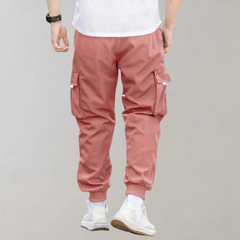 Olive green men's tapered cargo pants showcasing a lightweight utility fashion design, featuring a comfortable fit with visible pockets and seams, ideal for active or casual wear.