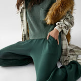 Olive green short sleeve knit sweater for women with a pocket, designed for summer wear, shown in size XL.