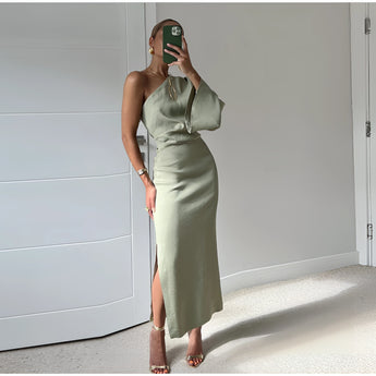 Olive green silk one-shoulder midi dress featuring a side slit, highlighting the waist and neck, suitable for day wear.
