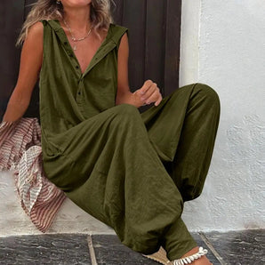 Woman wearing an olive green sleeveless V-neck summer jumpsuit with a casual and comfortable fit.