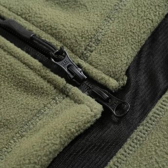 Olive green tactical fleece hoodie with military-inspired design, featuring a hood and long sleeves. The jacket is made from insulated textile material, suitable for outdoor activities. The grey and olive color scheme adds to its rugged and versatile appearance.