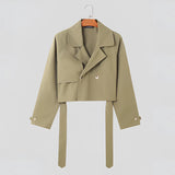 Olive green tie-waist cropped blazer in women's office style, featuring a tailored fit with a tie belt at the waist, long sleeves, and a classic lapel collar, suitable for professional and sophisticated wear.
