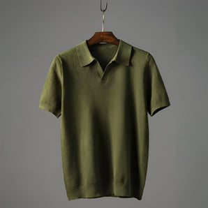 Olive green vintage short sleeve polo for men, displayed on a clothes hanger, featuring a classic collar, button-up design, and intricate knit pattern, styled for summer wear in size 2XL.