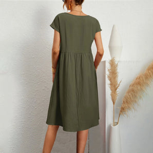 Olive green women's casual summer midi dress with short sleeves and a crew neck, highlighting a fitted waist and a comfortable, relaxed silhouette.