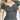 Olive green women's short sleeve casual t-shirt made of cotton fabric, featuring a crew neck and relaxed fit. The t-shirt is shown in a gray color variant in an XL size, highlighting the shoulder, arm, and waist areas.