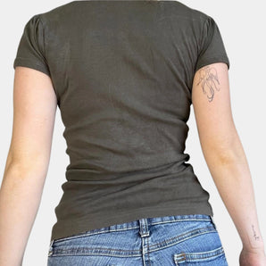 Olive green women's cotton short sleeve casual t-shirt displayed on a mannequin with focus on the round neckline and shoulder details.