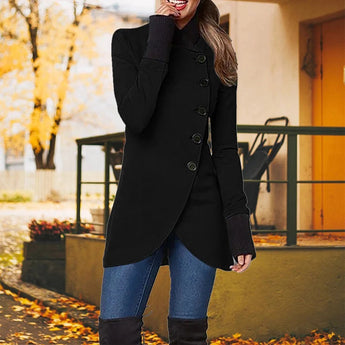 
A woman wearing a black elegant slim fit trench coat suitable for fall and winter fashion, featuring a tailored waist, long sleeves, and a classic collar. She is standing in a pose that highlights the coat's design.