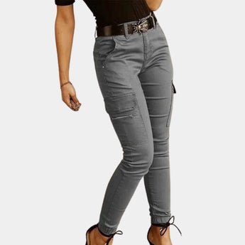 Olive green women's high-waisted skinny cargo pants with zipper detailing, showcasing multiple pockets and a fitted silhouette suitable for casual wear.
