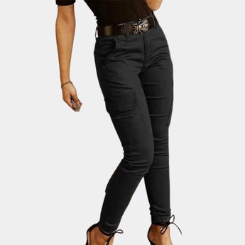 Olive green women's high-waisted skinny cargo pants featuring a zipper, designed with pockets on the sides and a fitted silhouette.