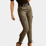 Olive green women's high-waisted skinny cargo pants with zipper, featuring a fitted design around the legs, styled with multiple pockets and a sleek zipper detail.