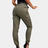 Olive green women's high-waisted skinny cargo pants featuring a zipper design.