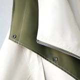 Olive green women's hooded cape jacket made from a silk blend, featuring an elegant military style design with a waist-length cut, wide sleeves, and a distinctive collar.
