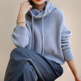 Olive green oversized women's hoodie with long sleeves and a cozy fit, featuring a collar and shoulder design, perfect for fall and winter fashion.