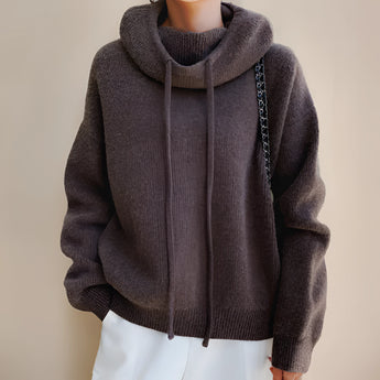 Olive green women's oversized hoodie with a cozy design, featuring long sleeves and a high collar, suitable for fall and winter fashion.