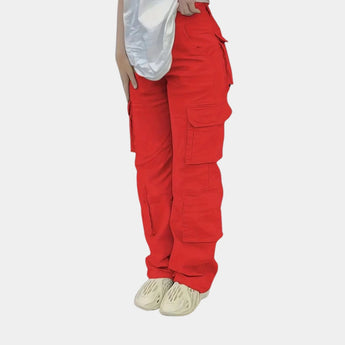 Olive green women's slim fit tactical cargo pants with multiple pockets, designed for active wear and equipped with knee detailing.