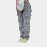 Olive green women's slim fit tactical cargo pants with pockets, featuring a high waist, knee and thigh detailing, suitable for workwear or sportswear.