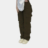 Olive green women's slim fit tactical cargo pants with multiple pockets, shown in a light green color, size XL.