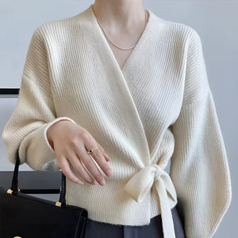 Olive green women's V-neck wrap sweater designed for casual autumn fashion, featuring a stylish wrap design that highlights the waist.