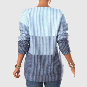 Women's ombre blue knit sweater, featuring long sleeves and a cozy fit, styled for winter fashion.