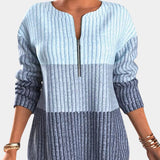 
A women's blue striped ombre gradient knit sweater, featuring long sleeves and a round neckline, displayed in an extra large size.