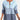 
A women's blue striped ombre gradient knit sweater, featuring long sleeves and a round neckline, displayed in an extra large size.