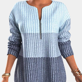
A women's blue striped ombre gradient knit sweater, featuring long sleeves and a round neckline, displayed in an extra large size.