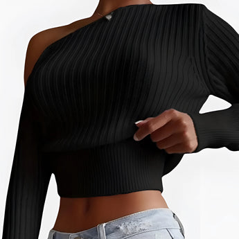 
A woman wearing a black one-shoulder ribbed knit crop top in an XL size, showcasing the asymmetrical design with a focus on the neckline and single sleeve, highlighting the fit around the waist.