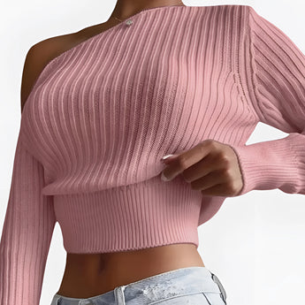 One-shoulder ribbed knit crop top in pink, showcasing an asymmetric design with long sleeves and a snug fit, ideal for women's fashion.