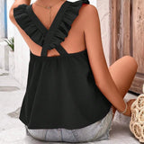 Orange sleeveless tank top with criss-cross back, worn by a woman, showcasing summer fashion style.