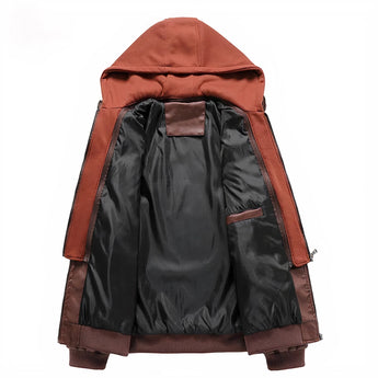 Orange hooded jacket with leather accents displayed on a mannequin, showcasing its urban style. The jacket features a stylish design suitable for winter, and includes elements like a patterned sleeve.