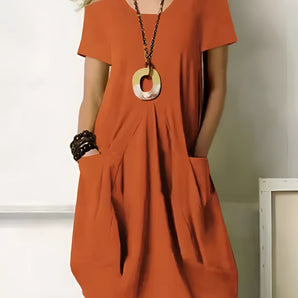 Orange oversized V-neck tunic dress with short sleeves, pockets, and breathable cotton fabric, shown in size 5XL.