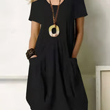 An orange oversized V-neck tunic dress with short sleeves, pockets, and breathable cotton fabric.