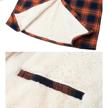 Men's orange plaid flannel shirt featuring a tartan pattern with long sleeves and pockets.