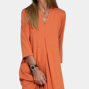 Orange V-neck long sleeve midi dress for women, made of cotton fabric, showcasing a casual tunic style with a distinctive collar and elegant sleeves.