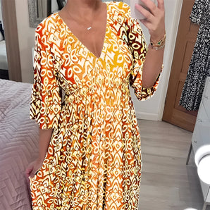 Orange and white geometric V-neck summer dress with a cinched waist, featuring short sleeves and designed as a day dress in size 5XL, shown in a yellow variant.