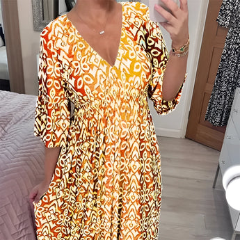 Orange and white geometric V-neck summer dress with a cinched waist, featuring short sleeves and designed as a day dress in size 5XL, shown in a yellow variant.