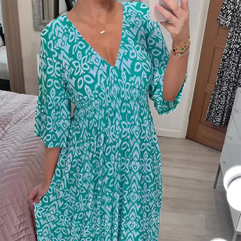Orange white geometric V-neck summer dress with a cinched waist, showcasing blue and azure patterns, featuring short sleeves and a flowing one-piece garment design in size 5XL.