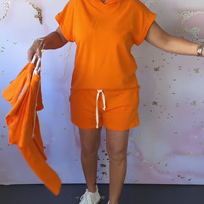 Orange women's casual shorts set with a drawstring and hooded top, featuring a comfortable and stylish summer design.