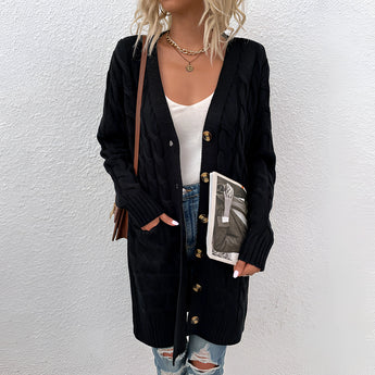 Oversized black cable knit cardigan with cozy texture, featuring a shawl collar, long sleeves, and an open front style.