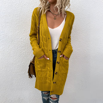 
A cozy oversized beige cable knit cardigan with a stylish pattern, featuring a relaxed fit and long sleeves, ideal for winter fashion.