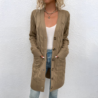 Oversized beige cable knit cardigan with a cozy texture, featuring an open front design and long sleeves.
