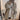 Oversized beige chunky knit women's cardigan featuring a cozy design, long sleeves, and a relaxed fit, perfect for winter fashion.